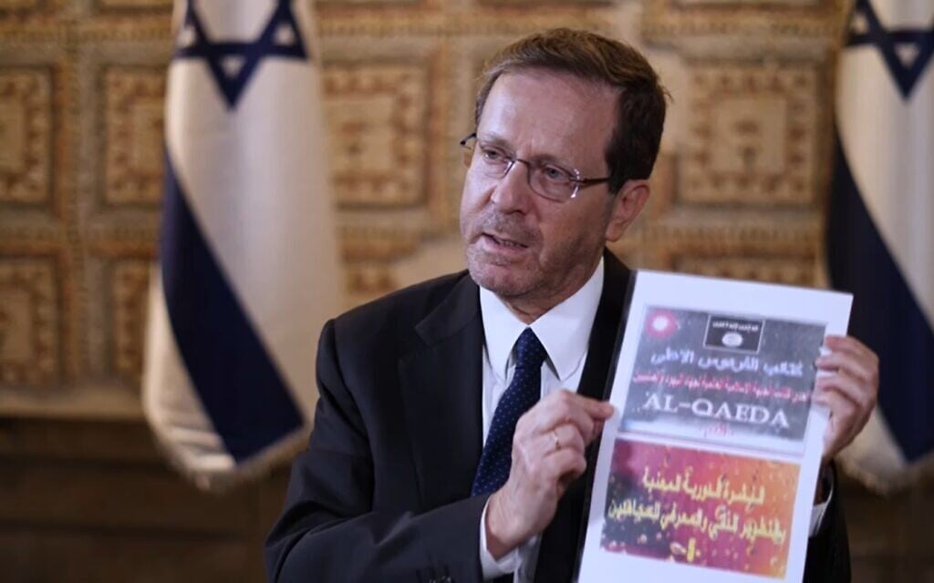 President Isaac Herzog shows materials recovered from the body of a Hamas terrorist during an interview with Sky News, October 22, 2023. (Screenshot: used in accordance with Clause 27a of the Copyright Law)