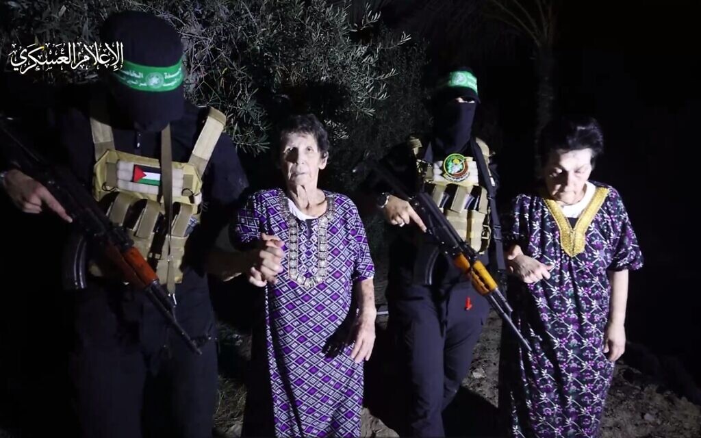 A still from a video released by Hamas's armed wing showing hostages Yocheved Lifshitz, left, and Nurit Cooper before their release from captivity, October 23, 2023. (screen capture) A still from a video released by Hamas's armed wing showing hostages Yocheved Lifshitz, left, and Nurit Cooper before their release from captivity, October 23, 2023. (screen capture)