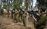Israeli Infantry reservists seen during light arms training in the northern Golan Heights before heading south to the Gaza Strip on October 8, 2023. (Michael Giladi/Flash90)