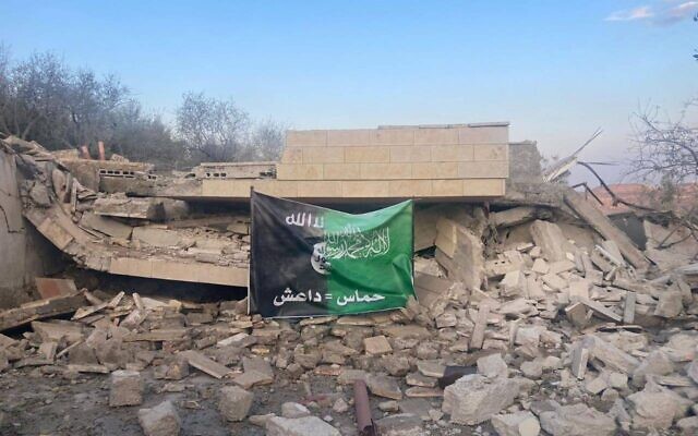 A building belonging to Hamas deputy political bureau leader Saleh al-Arouri in the West Bank town of ‘Arura seen after it was demolished by the IDF, October 31, 2023. Banner shows combined flags of Hamas and Islamic State with slogan, in Arabic 'Hamas=IS." A building belonging to Hamas deputy political bureau leader Saleh al-Arouri in the West Bank town of ‘Arura seen after it was demolished by the IDF, October 31, 2023. Banner shows combined flags of Hamas and Islamic State with slogan, in Arabic 'Hamas=IS."