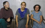 A screenshot from a propaganda video released by Hamas on October 30, 2023, showing three Israeli hostages: Rimon Buchshtab Kirsht (left), Danielle Aloni (center), and Lena Trufanov (right)