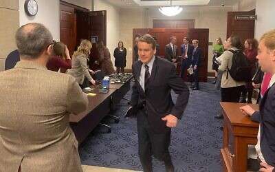 Sen. Michael Bennet, a Colorado Democrat, runs out of a Senate room where there was a screening of the October 7 Hamas atrocities, in the US Capitol, November 28, 2023. (Ron Kampeas/ JTA)