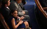 US Rep. Alexandria Ocasio-Cortez sits in the US House of Representatives at the US Capitol in Washington, DC, January 3, 2023. (Mandel Ngan/AFP)