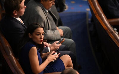 US Rep. Alexandria Ocasio-Cortez sits in the US House of Representatives at the US Capitol in Washington, DC, January 3, 2023. (Mandel Ngan/AFP)