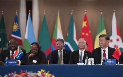 File: President of China Xi Jinping (R) and South African President Cyril Ramaphosa (L) attend the China-Africa Leaders' Roundtable Dialogue on the last day of the 2023 BRICS Summit in Johannesburg on August 24, 2023. (ALET PRETORIUS / POOL / AFP)