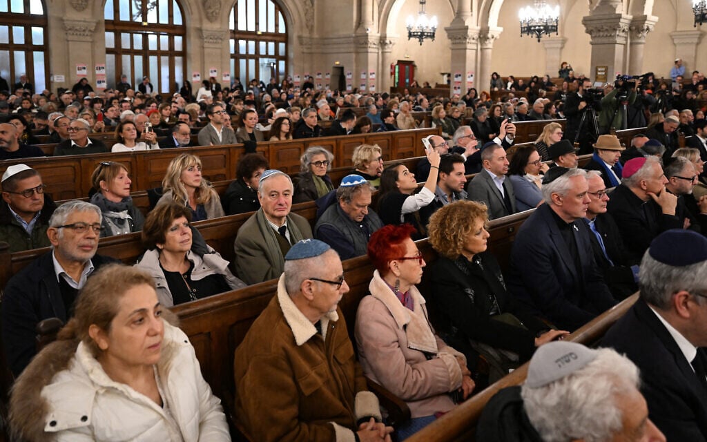 People take part in an event held under the theme of "unity" at the Great Synagogue of Paris, on October 31, 2023. (Photo by Miguel MEDINA / AFP)