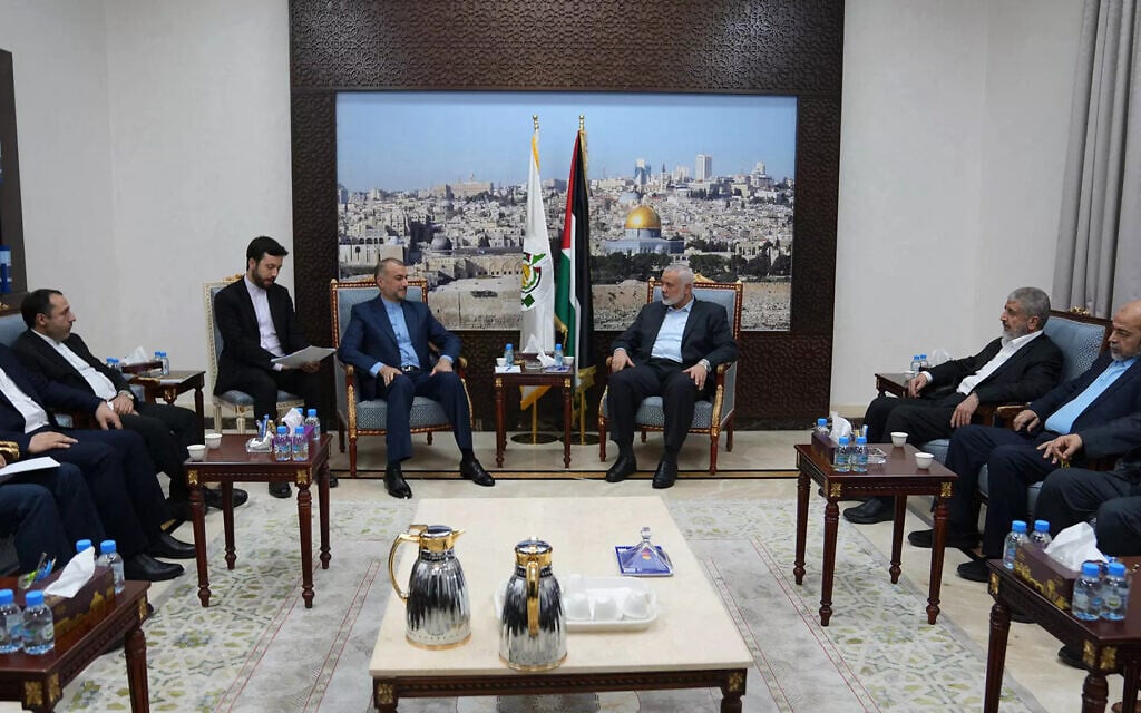 Iran's Foreign Minister Hossein Amir Abdollahian (C-L) meets with Hamas's political bureau chief Ismail Haniyeh (C-R) and other Hamas leaders in Doha. (Photo by Iranian Foreign Ministry / AFP)