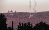 Rockets fired from southern Lebanon are intercepted above a position across the border near Kibbutz Dan in northern Israel on November 7, 2023. (Jalaa Marey/AFP)