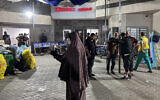 People stand outside the emergency ward of Shifa Hospital in Gaza City on November 10, 2023, amid the ongoing war between Israel and Hamas. (Khader Al Zanoun/AFP)