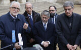Rector of the Great Mosque of Paris, Chems-eddine Hafiz (L), flanked by Archbishop of Reims and President of the Conference des Eveques de France (CEF - Bishops' Conference of France) Eric de Moulins-Beaufort (R), Grand Rabbi of France Haim Korsia (C), President of  the Orientation Council of the Foundation of Islam of France (FORIF) Sadek Beloucif (2ndL), address media during a press conference after a meeting between France's president and France's religious representatives at the Elysee Palace in Paris on November 13, 2023. (Ludovic MARIN / AFP)