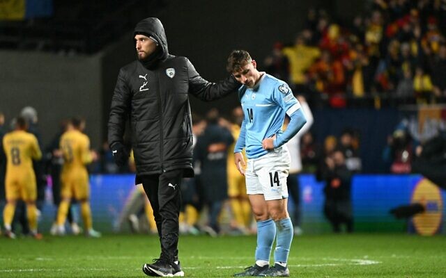 Israeli players including midfielder #14 Gavriel Kanichowsky, right, react after the UEFA Euro 2024 group I qualification football match between Israel and Romania in Felcsut on November 18, 2023. (Attila KISBENEDEK / AFP) Israeli players including midfielder #14 Gavriel Kanichowsky, right, react after the UEFA Euro 2024 group I qualification football match between Israel and Romania in Felcsut on November 18, 2023. (Attila KISBENEDEK / AFP)