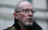 Thomas Hand, father of Emily Hand, an Israeli-Irish girl held hostage by Palestinian terror group Hamas in Gaza, attends a demonstration to protest against antisemitism and to call for the release of the hostages, outside Downing Street on November 19, 2023. (JUSTIN TALLIS / AFP)