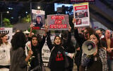 Families of Israeli hostages held by Palestinian terrorists in the Gaza Strip protest outside the Defense Ministry in Tel Aviv calling for their release, on November 21, 2023, during the ongoing war between Israel and Hamas. (Ahmad Gharabli/AFP)