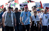 (L-R) Cuba's Prime Minister Manuel Marrero, Cuba's President Miguel Diaz-Canel, and his wife Lis Cuesta take part in a march in support of the Palestinian people and against Israel's war with Hamas in Havana, Cuba on November 23, 2023. (Yamil Lage/AFP)