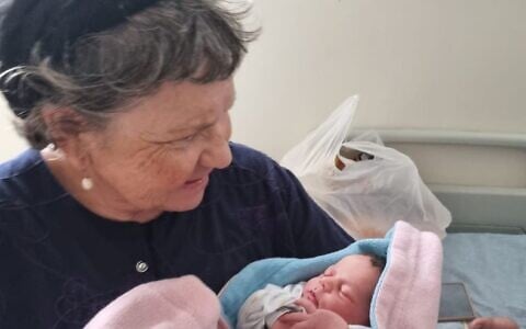 Marcelle Taljah, seen with her new granddaughter on October 6, a day before she was murdered. (Courtesy)