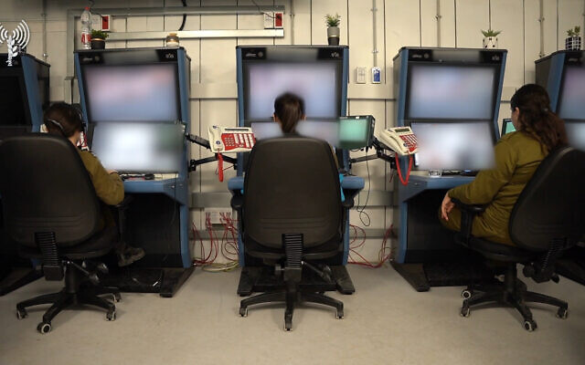 Soldiers are seen monitoring surveillance cameras at a command center at the IDF's Re'im camp in southern Israel, November 5, 2023 (Israel Defense Forces)