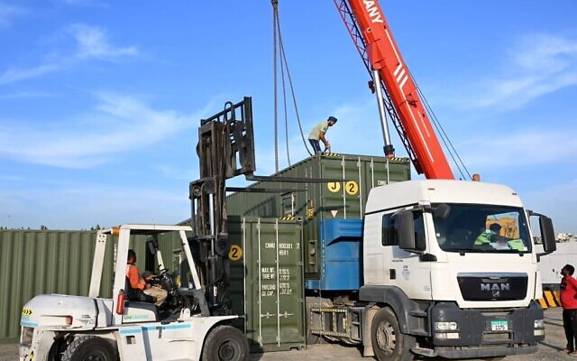Parts for a desalination plant to be set up in the Gaza Strip are loaded onto trucks in the UAE on November 16, 2023 (WAM) Parts for a desalination plant to be set up in the Gaza Strip are loaded onto trucks in the UAE on November 16, 2023 (WAM)