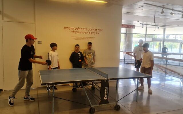 Students play ping pong in the lobby of the old National Library of Israel building, in an undated photo. (courtesy NLI)