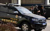 Illustrative: Brazilian Federal Police agents stand at Federal Police headquarters minutes before the arrival of Brazil's former President Jair Bolsonaro who will testify in Brasilia, Brazil, Thursday, Aug. 31, 2023. (AP/Eraldo Peres)