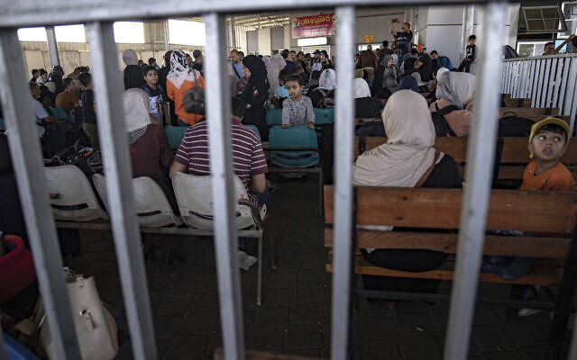 Palestinians wait to cross into Egypt at Rafah, Gaza Strip, on Nov. 1, 2023. (AP Photo/Fatima Shbair) Palestinians wait to cross into Egypt at Rafah, Gaza Strip, on Nov. 1, 2023. (AP Photo/Fatima Shbair)