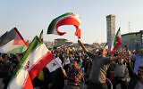Iranian demonstrators wave Iranian and Palestinian flags during a pro-Palestinian rally in Tehran, Iran, Friday, Nov. 3, 2023. (AP Photo/Vahid Salemi)