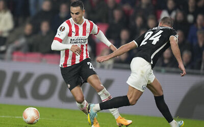 FILE - Then-PSV's and currently Bundesliga's Mainz player Anwar El Ghazi, left, scores his side's fifth goal during the Europa League group A soccer match between PSV and Zurich at the Philips stadium in Eindhoven, Netherlands, on October 13, 2022. (AP Photo/Peter Dejong, File) FILE - Then-PSV's and currently Bundesliga's Mainz player Anwar El Ghazi, left, scores his side's fifth goal during the Europa League group A soccer match between PSV and Zurich at the Philips stadium in Eindhoven, Netherlands, on October 13, 2022. (AP Photo/Peter Dejong, File)