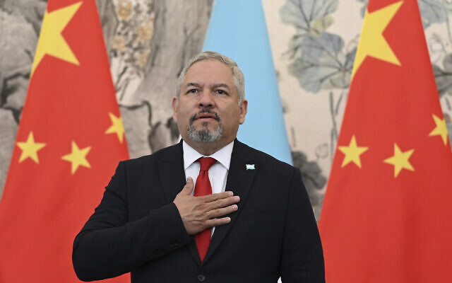 Foreign Minister Eduardo Enrique Reina of Honduras stands for the playing of national anthems during a ceremony in Beijing, March 26, 2023. (Greg Baker/Pool Photo via AP, File) Foreign Minister Eduardo Enrique Reina of Honduras stands for the playing of national anthems during a ceremony in Beijing, March 26, 2023. (Greg Baker/Pool Photo via AP, File)