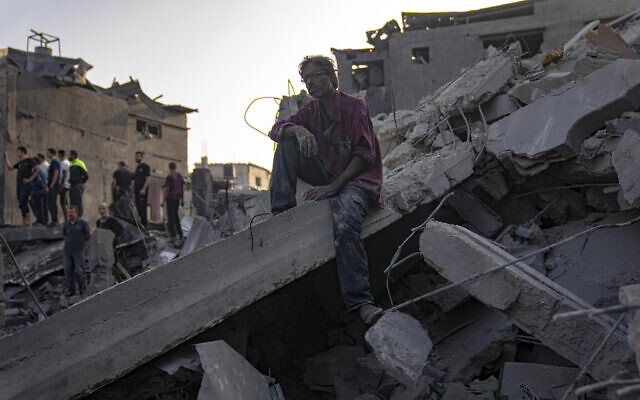 Palestinians look for survivors of an Israeli bombing in Maghazi, Gaza Strip, Nov. 5, 2023. (AP Photo/Fatima Shbair) Palestinians look for survivors of an Israeli bombing in Maghazi, Gaza Strip, Nov. 5, 2023. (AP Photo/Fatima Shbair)