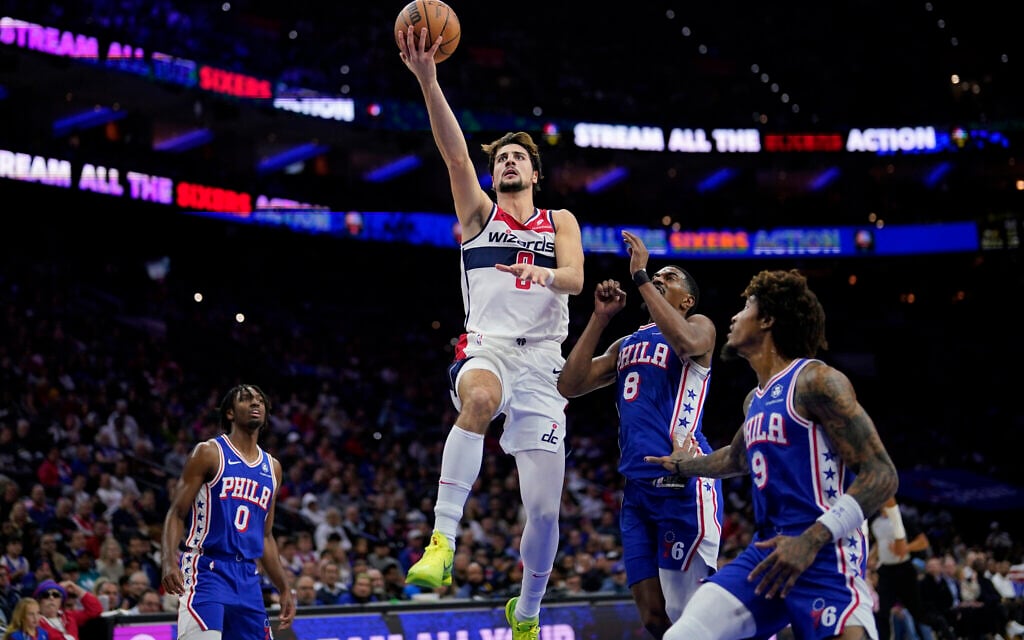 Washington Wizards' Deni Avdija, left, goes up for a shot against Philadelphia 76ers' De'Anthony Melton during the first half of an NBA basketball game, November 6, 2023, in Philadelphia. (AP Photo/Matt Slocum)