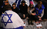 Demonstrators portray hostages kidnapped from Israel during the brutal October 7 Hamas invasion during a vigil in Prague, Czech Republic, November 7, 2023. (AP Photo/Petr David Josek)