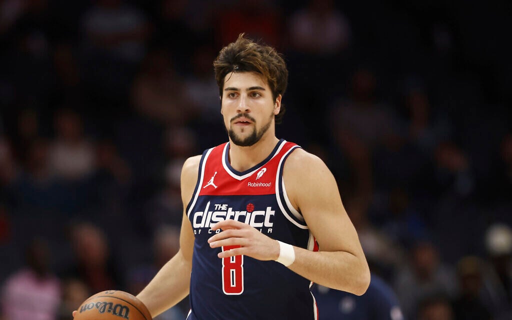 Washington Wizards forward Deni Avdija brings the ball up court against the Charlotte Hornets during the first half of an NBA basketball game in Charlotte, N.C., November 8, 2023. (AP Photo/Nell Redmond)