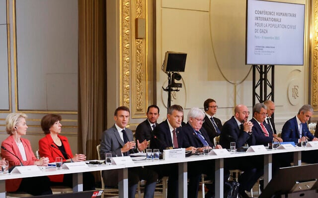 French President Emmanuel Macron, center, speaks during a meeting with officials from Western and Arab nations, the United Nations and nongovernmental organizations at the Elysee Palace, in Paris, November 9, 2023. (Ludovic Marin, Pool via AP) French President Emmanuel Macron, center, speaks during a meeting with officials from Western and Arab nations, the United Nations and nongovernmental organizations at the Elysee Palace, in Paris, November 9, 2023. (Ludovic Marin, Pool via AP)