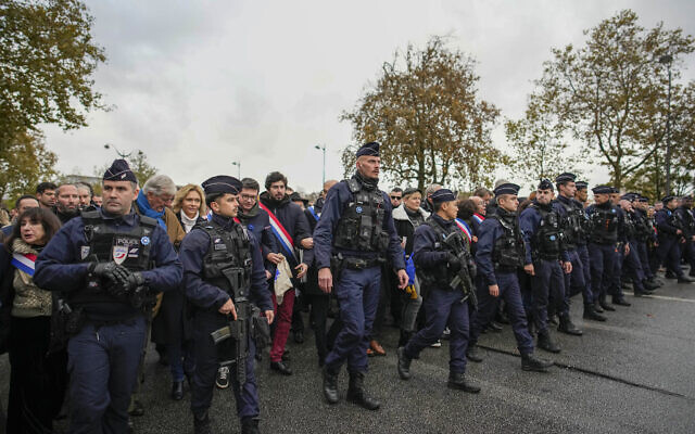 French police regulate thousands who gathered for a march against antisemitism in Paris, France, November 12, 2023. (AP Photo/Christophe Ena)