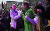 Climate activist Greta Thunberg is interrupted by a climate activist after Thunberg expressed solidarity with the Palestinians, during a rally in Amsterdam, Nov. 12, 2023. (AP Photo/Peter Dejong)