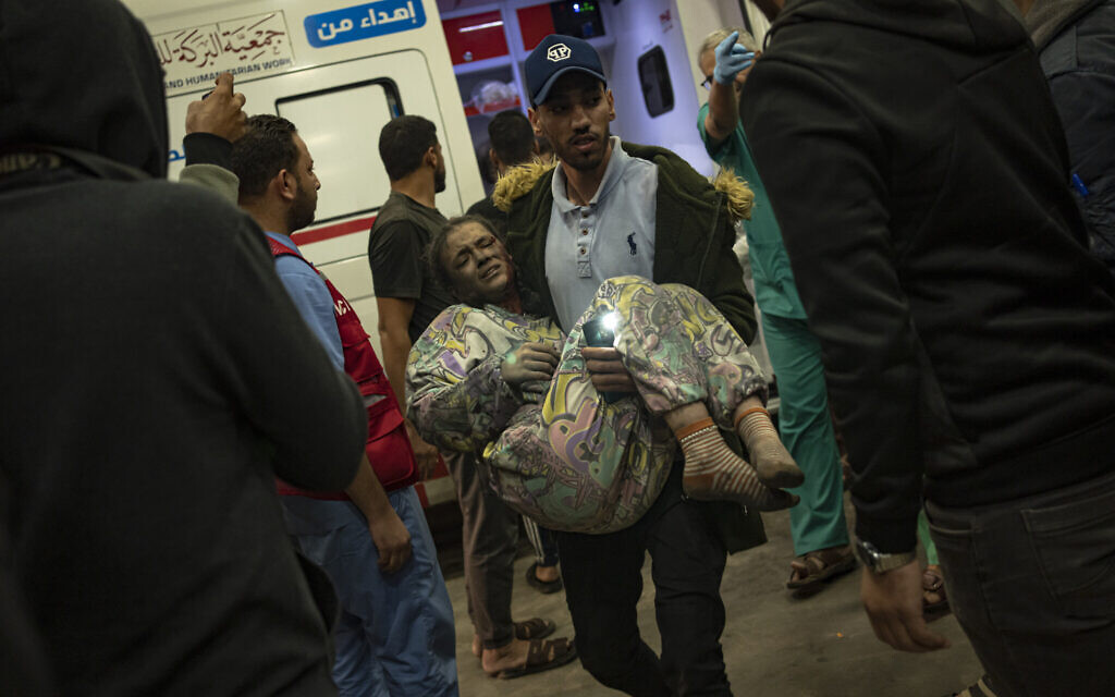 A Palestinian said to have been wounded in an Israeli strike on the Gaza Strip is brought to a hospital in Khan Younis, Nov. 15, 2023. (AP Photo/Fatima Shbair)