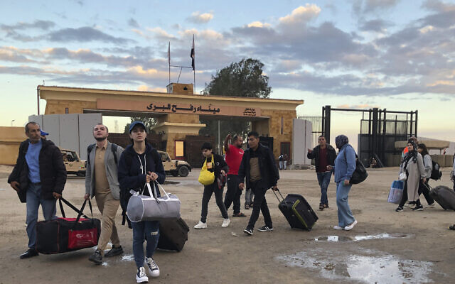 Palestinians with European passports who were evacuated from Gaza cross at the Rafah border crossing into Egypt, November 15, 2023. (AP Photo) Palestinians with European passports who were evacuated from Gaza cross at the Rafah border crossing into Egypt, November 15, 2023. (AP Photo)