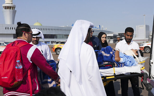 Medical personnel and officials move Mohammed Abu Tabikh, 14, who was wounded in the neck and spine during the Israel-Hamas war, from a plane to an ambulance on a stretcher in Abu Dhabi, United Arab Emirates, Saturday, Nov. 18, 2023 (AP Photo/Malak Harb) Medical personnel and officials move Mohammed Abu Tabikh, 14, who was wounded in the neck and spine during the Israel-Hamas war, from a plane to an ambulance on a stretcher in Abu Dhabi, United Arab Emirates, Saturday, Nov. 18, 2023 (AP Photo/Malak Harb)