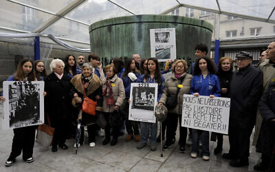 French Nazi hunter Serge Klarsfeld, right, his wife Beate, second from right, and French Holocaust survivors Edith Senot, third from left, and Ginette Kolinka, fifth from left, attend a gathering in the Paris Holocaust Memorial war of resurgent antisemitism linked to the 2023 Israel-Hamas war, in Paris, November 18, 2023. (AP Photo/Thibault Camus)