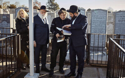Argentina's president-elect, Javier Milei, second right, visits the Montefiore Cemetery after praying next to Chabad-Lubavitch rabbis at the resting place of the Rebbe, Rabbi Menachem Mendel Schneerson, in New York, November 27, 2023. (AP Photo/Andres Kudacki)