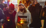 People gather for a vigil in Pliny Park in Brattleboro, Vermont, for three Palestinian-American students who were shot while walking near the University of Vermont campus in Burlington, Vermont, seen November 27, 2023. (Kristopher Radder/The Brattleboro Reformer via AP)