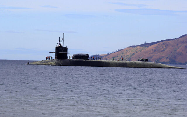 US Navy crew stand on the USS Michigan (SSGN-727), an Ohio-class guided missile submarine, as it prepares to dock at Subic Freeport, a former US naval base Tuesday, March 25, 2014 about 70 kilometers (44 miles) west of Manila, Philippines. (AP/Jun Dumaguing) US Navy crew stand on the USS Michigan (SSGN-727), an Ohio-class guided missile submarine, as it prepares to dock at Subic Freeport, a former US naval base Tuesday, March 25, 2014 about 70 kilometers (44 miles) west of Manila, Philippines. (AP/Jun Dumaguing)