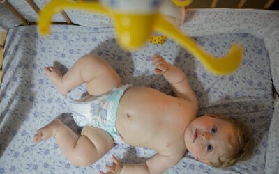Illustrative: A baby boy in his crib. July 15, 2019. (Chen Leopold/FLASH90)