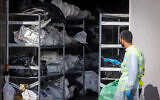 A member of Zaka at the forensic center in the Shura military base near Ramle, on October 13, 2023. where hundreds of dead bodies have arrived since Hamas-led terrorists rampaged through southern Israel on October 7, 2023, killing some 1,200 people. (Nati Shohat/Flash90)