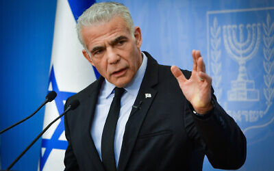 Illustrative: Opposition Leader Yair Lapid speaks during a press conference in Tel Aviv, October 26, 2023. (Avshalom Sassoni/Flash90)