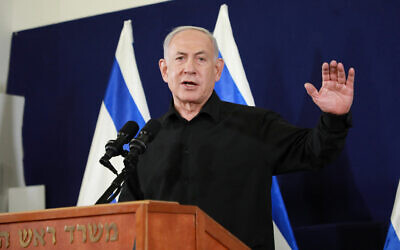 Prime Minister Benjamin Netanyahu speaks at a press conference at the Defense Ministry, in Tel Aviv, October 28, 2023. (Dana Kopel/POOL)
