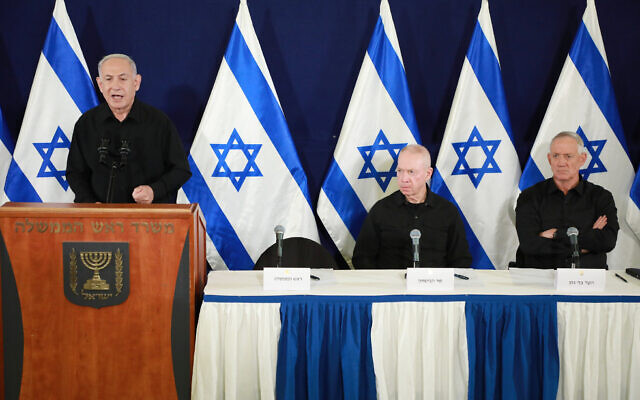 From left to right: Prime Minister Benjamin Netanyahu, Defense Minister Yoav Gallant and Minister Benny Gantz hold a joint press conference at the Defense Ministry in Tel Aviv, October 28, 2023. (Dana Kopel/Pool/Flash90)