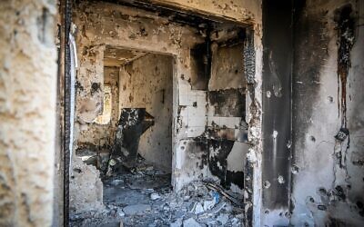 Illustrative: Destruction caused by Hamas terrorists on October 7, in Kibbutz Kfar Aza, near the Israeli-Gaza border, seen on November 2, 2023. (Arie Leib Abrams/Flash90)