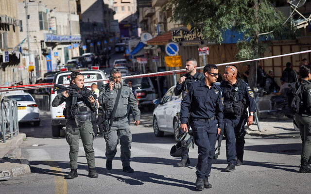 Israeli security forces and rescue forces at the scene of an attack outside a police station outside Jerusalem's Old City, November 6, 2023. (Chaim Goldberg/ Flash90) Israeli security forces and rescue forces at the scene of an attack outside a police station outside Jerusalem's Old City, November 6, 2023. (Chaim Goldberg/ Flash90)