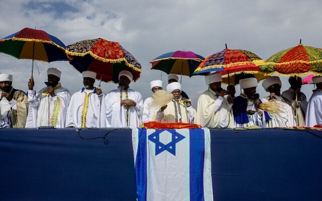 Ethiopian Jews take part in a prayer of the Sigd holiday on the Armon Hanatziv Promenade overlooking Jerusalem on November 13, 2023. (Chaim Goldberg/ Flash90) Ethiopian Jews take part in a prayer of the Sigd holiday on the Armon Hanatziv Promenade overlooking Jerusalem on November 13, 2023. (Chaim Goldberg/ Flash90)