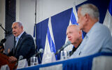 FILE - Prime Minister Benjamin Netanyahu, Defense Minister Yoav Gallant, and war cabinet Minister Benny Gantz address a press conference at the Defense Ministry headquarters in Tel Aviv, November 22, 2023. (Chaim Goldberg/Flash90)